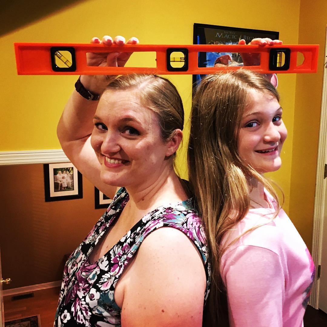 It only took Kate 11 years and 8 months to pass her mama in height. We even used a level to prove it! Now less than 7" left to catch daddy. #tallgirl #family #imstilltaller