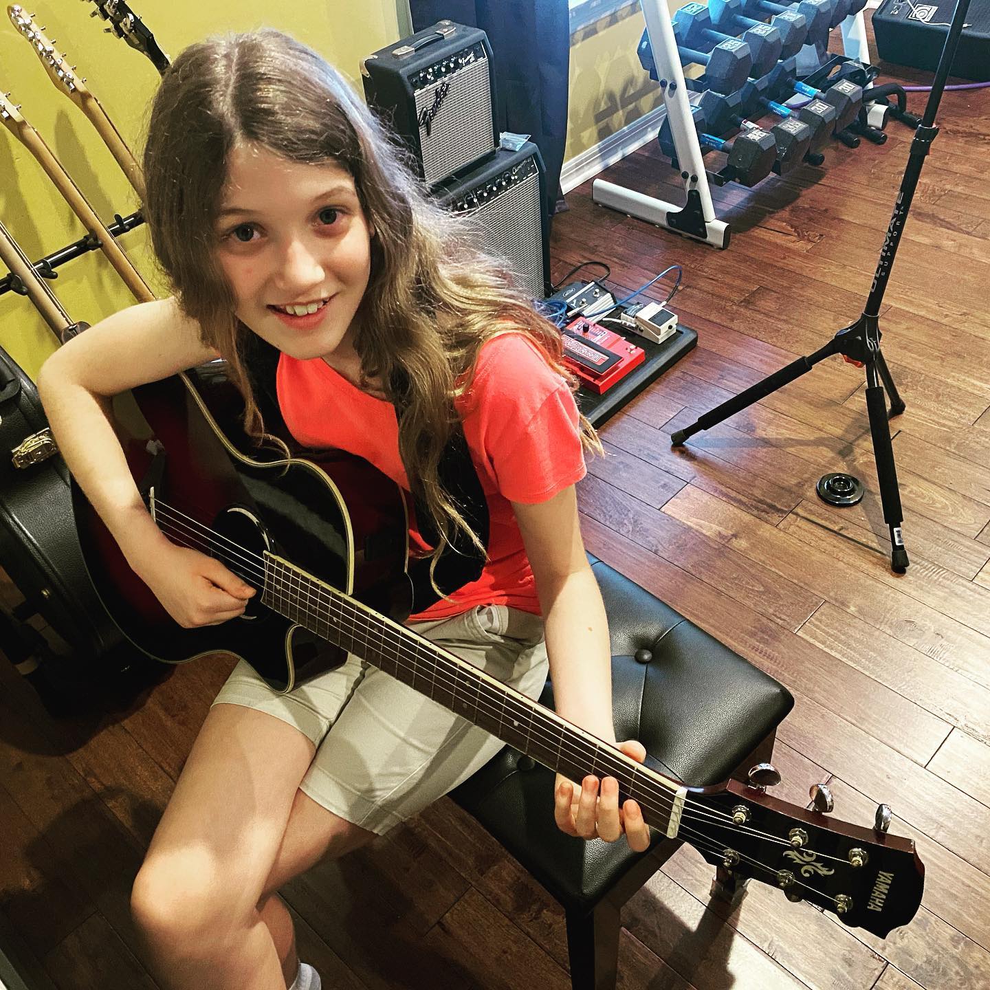 Sara is adding guitar to to her musical arsenal that already includes piano and cello. #family #music #guitar